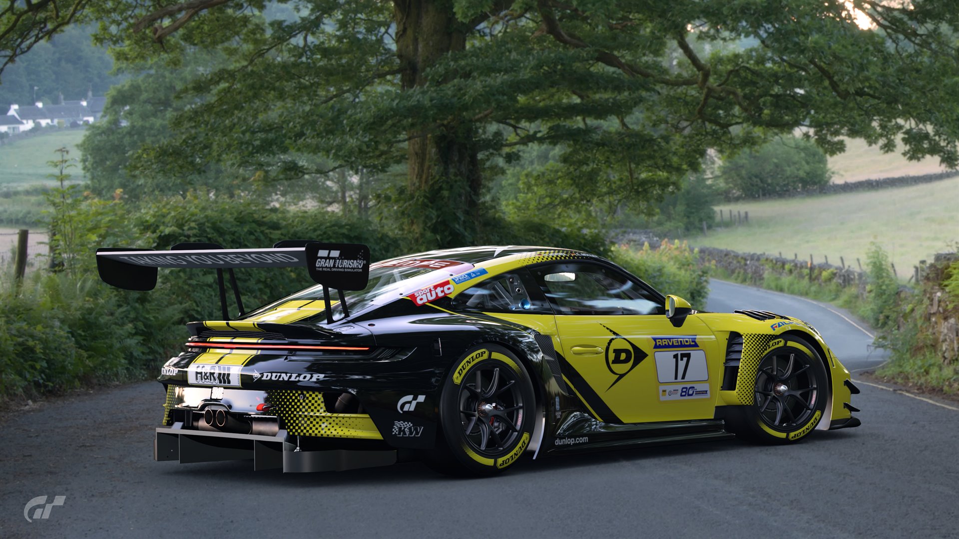Yellow Porsche race car on track
